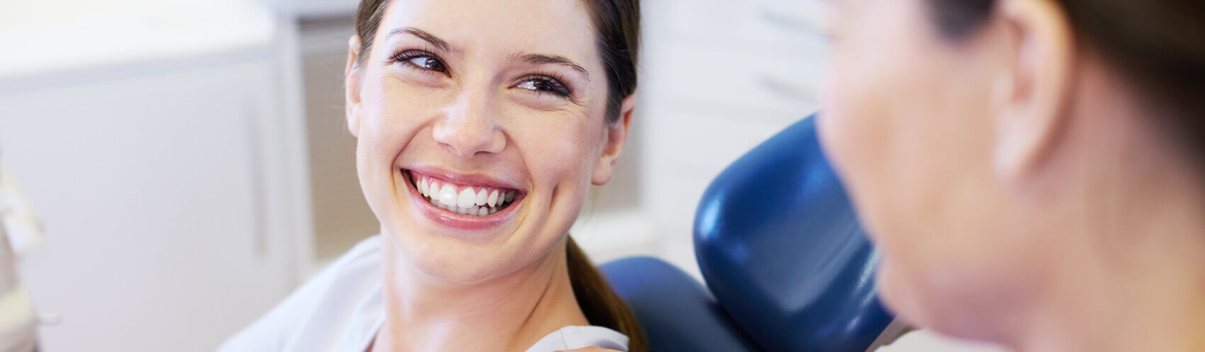 Woman smiling at the dentist