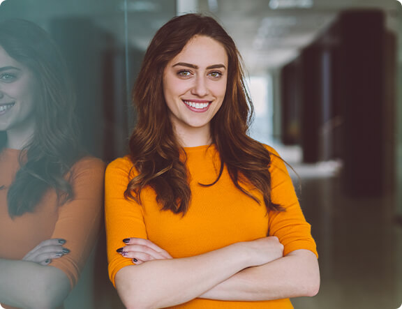 woman with crossed arms smiling