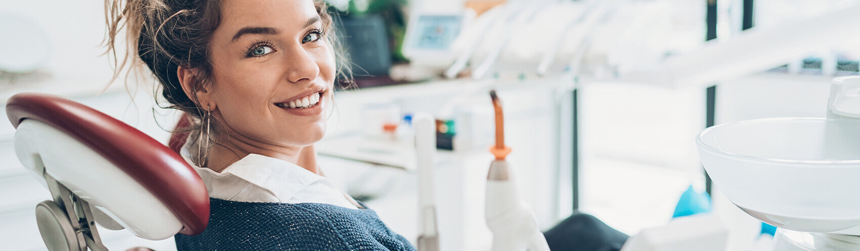Woman sitting in dental exam chair