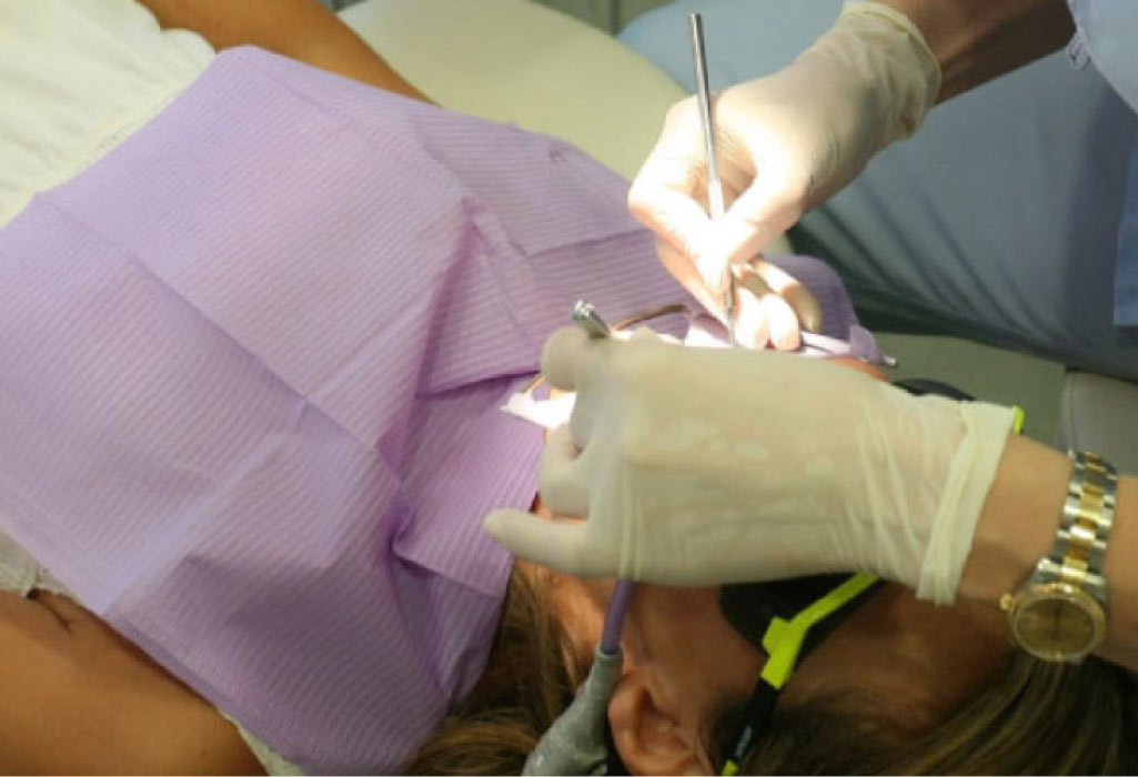 patient undergoing a tooth extraction at the dentist