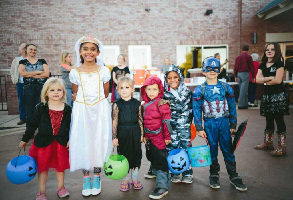 group of kids dressed up for Halloween