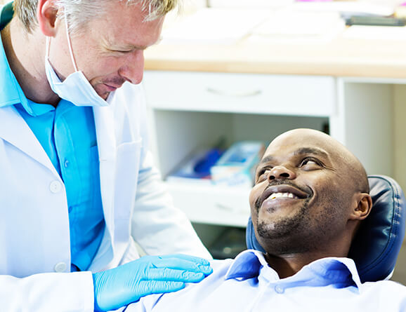 man speaking with his dentist