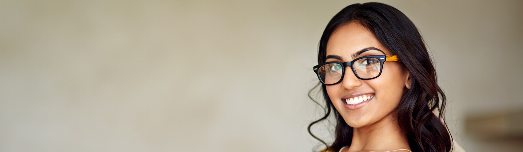 Woman with glasses smiling