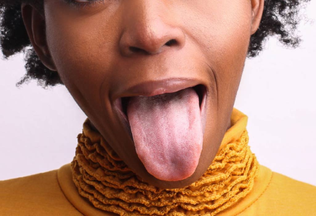 woman sticks out her tongue