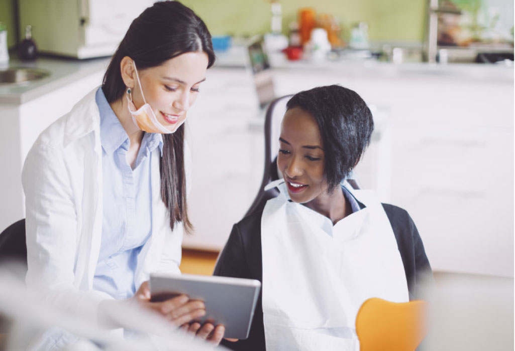 young woman meets with the dental tech of a consultation