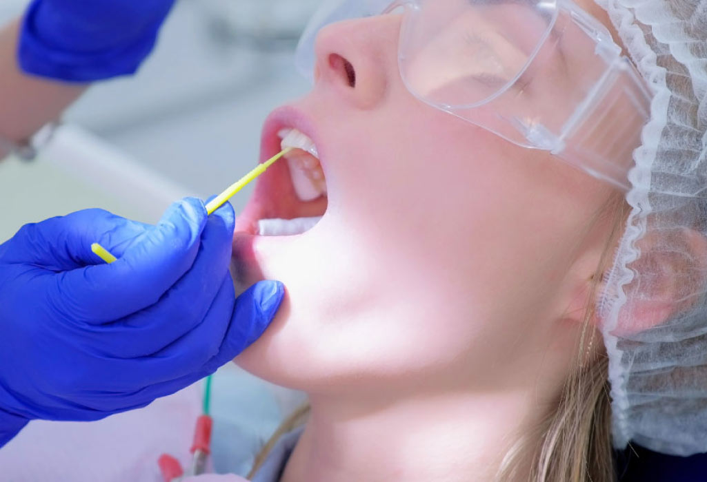 dental patient gets a fluoride treatment