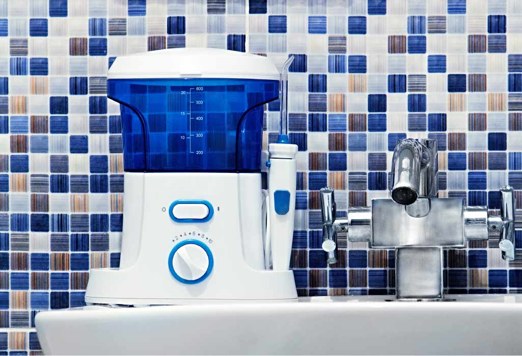 waterpik flosser sitting on a bathroom counter