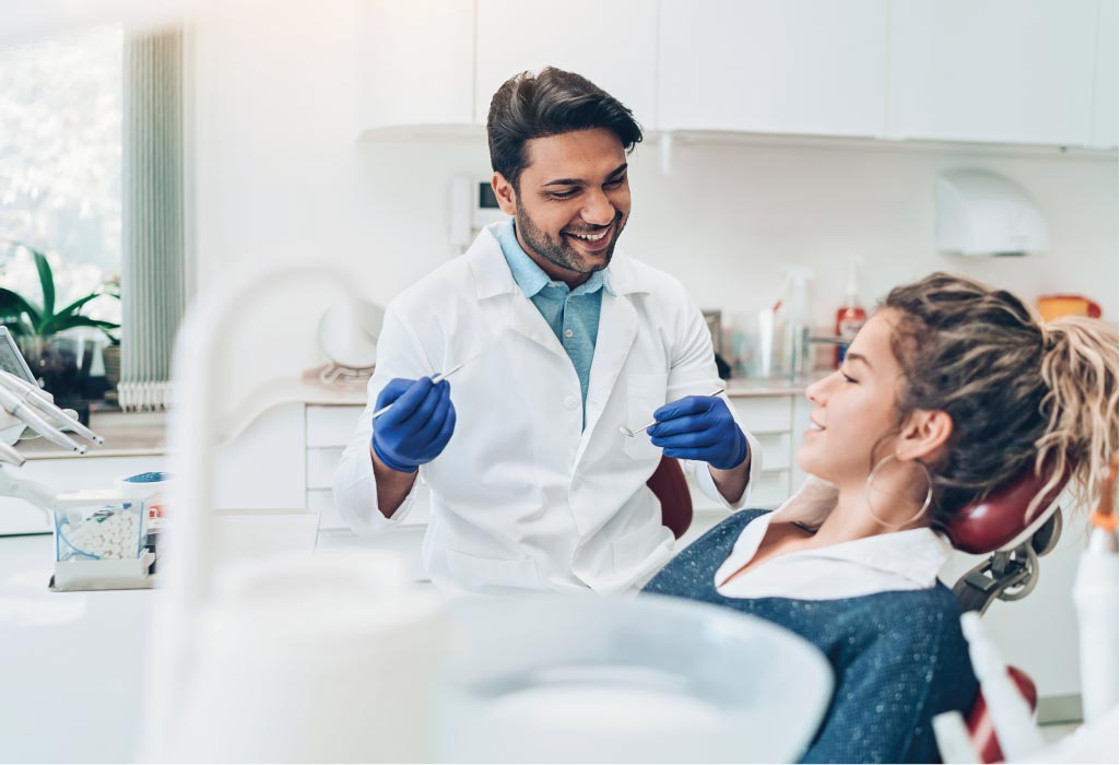 woman gets a deep teeth cleaning at the dentist