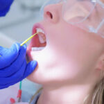 dental patient undergoes fluoride treatment